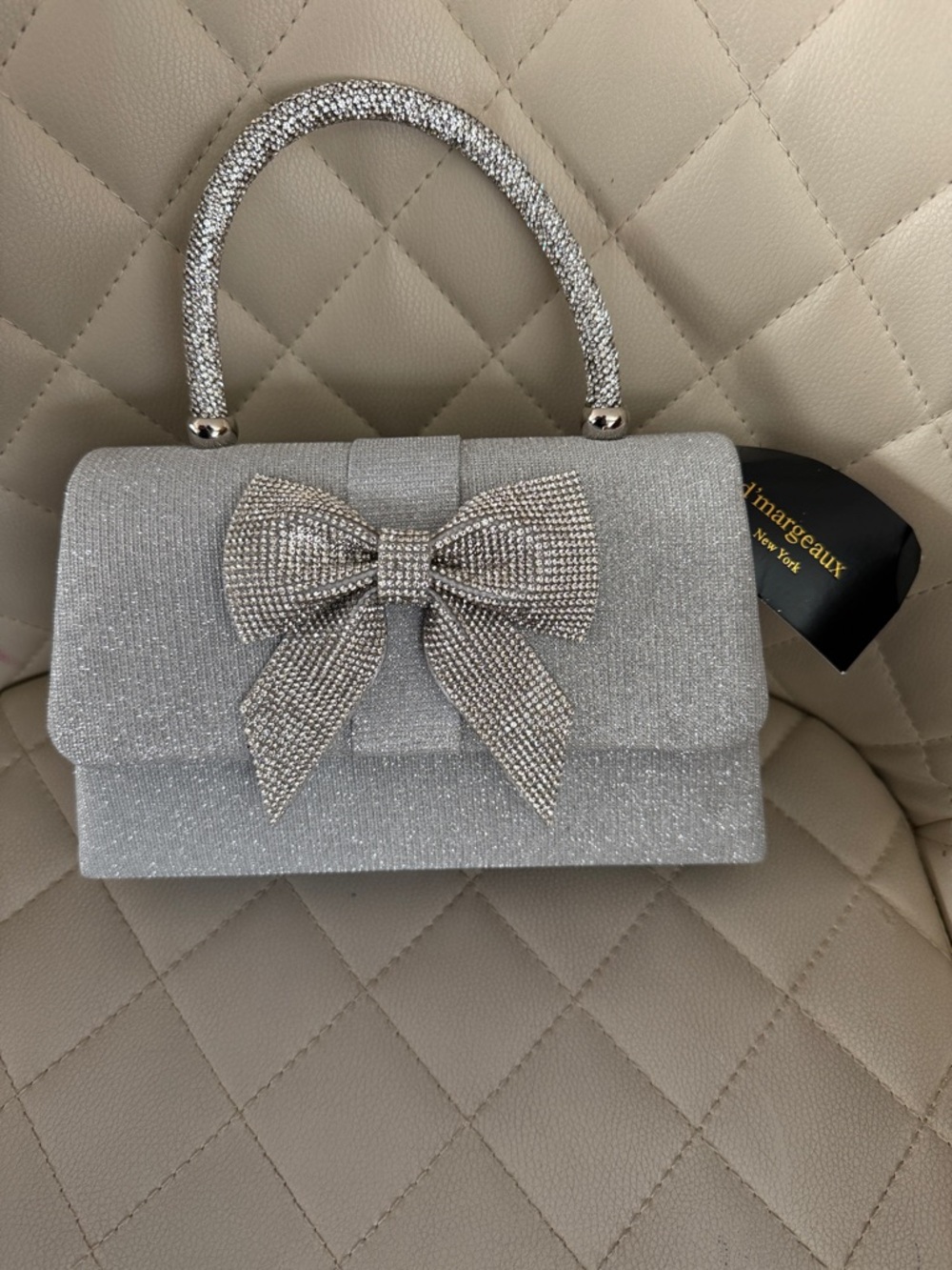 Sparkling Silver Bow Top-Handle Clutch